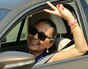 Smiling woman inside a car 